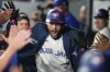 Toronto Blue Jays' George Springer celebrates after hitting a two-run home run against the Cincinnati Reds during second inning interleague MLB baseball action in Toronto on Tuesday, Aug. 20, 2024. THE CANADIAN PRESS/Chris Young