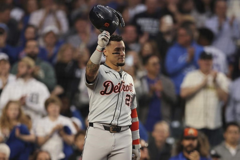 Detroit Tigers' Javier Báez raises his helmet to the fans on his first game back at Wrigley Field during the second inning to a baseball game against the Chicago Cubs Tuesday, Aug. 20, 2024, in Chicago. (AP Photo/Melissa Tamez)