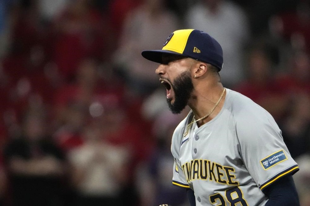 Milwaukee Brewers relief pitcher Devin Williams celebrates after striking out St. Louis Cardinals' Nolan Gorman for the final out of a baseball game Tuesday, Aug. 20, 2024, in St. Louis. The Brewers won 3-2. (AP Photo/Jeff Roberson)
