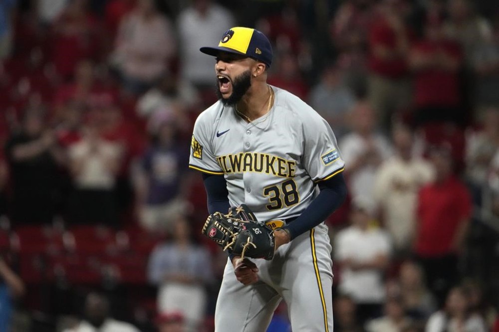 Milwaukee Brewers relief pitcher Devin Williams celebrates after striking out St. Louis Cardinals' Nolan Gorman for the final out of a baseball game Tuesday, Aug. 20, 2024, in St. Louis. The Brewers won 3-2. (AP Photo/Jeff Roberson)