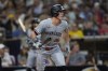 Minnesota Twins' Max Kepler watches his single during the fifth inning of a baseball game against the San Diego Padres, Tuesday, Aug. 20, 2024, in San Diego. (AP Photo/Gregory Bull)