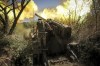 In this photo provided by Ukraine's 24th Mechanised Brigade press service, servicemen of the 24th Mechanised Brigade fire a