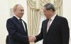 Russian President Vladimir Putin and Chinese Premier Li Qiang shake hands during their meeting at the Kremlin in Moscow, Russia, Wednesday, Aug. 21, 2024. (Alexey Filippov, Sputnik, Kremlin Pool Photo via AP)