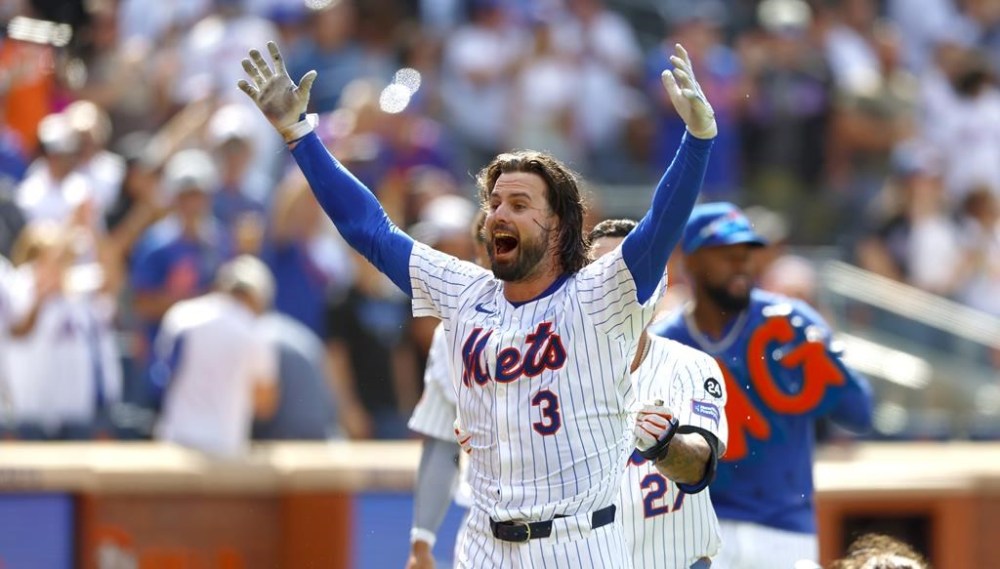 New York Mets' Jesse Winker reacts after hitting a walk off home run against the Baltimore Orioles during the ninth inning of a baseball game, Wednesday, Aug. 21, 2024, in New York.(AP Photo/Noah K. Murray)