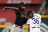 Pittsburgh Pirates shortstop Oneil Cruz throws to first over Texas Rangers' Wyatt Langford (36) to complete a ground out by Travis Jankowski in the second inning of a baseball game, Wednesday, Aug. 21, 2024, in Arlington, Texas. (AP Photo/Tony Gutierrez)