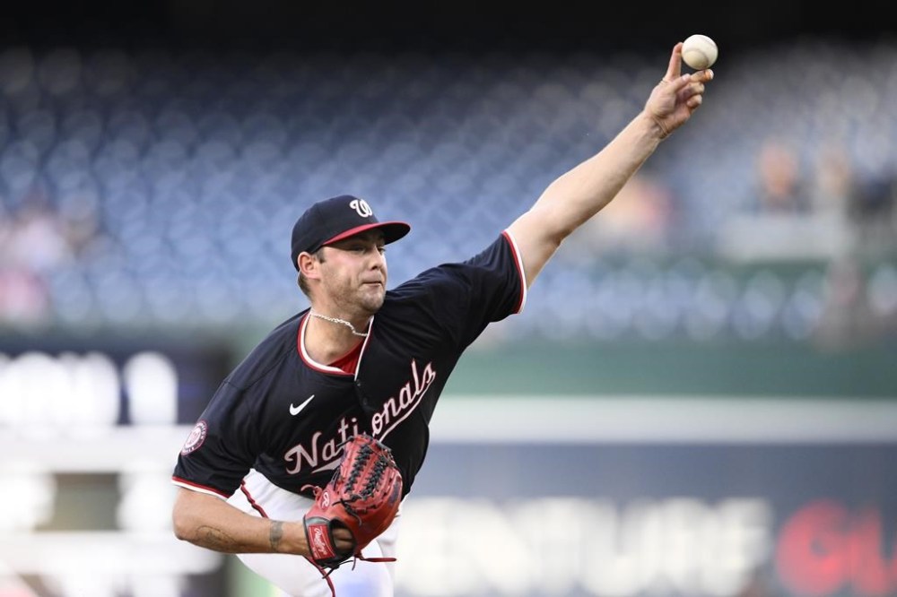 Washington Nationals starting pitcher Mitchell Parker throws during the first inning of a baseball game against the Colorado Rockies, Wednesday, Aug. 21, 2024, in Washington. (AP Photo/Nick Wass)