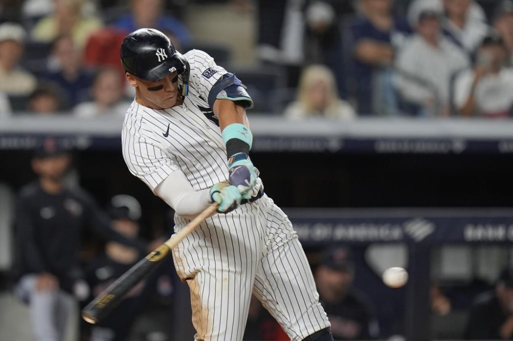 New York Yankees' Aaron Judge hits a solo home run during the seventh inning of a baseball game against the Cleveland Guardians, Wednesday, Aug. 21, 2024, in New York. (AP Photo/Seth Wenig)