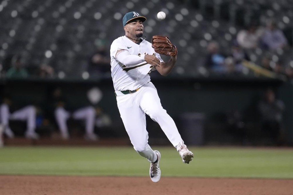 Oakland Athletics third baseman Darell Hernaiz throws out Tampa Bay Rays' Alex Jackson at first base during the ninth inning of a baseball game in Oakland, Calif., Wednesday, Aug. 21, 2024. (AP Photo/Jeff Chiu)