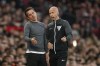 Fulham's head coach Marco Silva, left, reacts as he talks with an official during the English Premier League soccer match between Manchester United and Fulham at Old Trafford, Friday, Aug. 16, 2024, in Manchester, England. (AP Photo/Dave Thompson)
