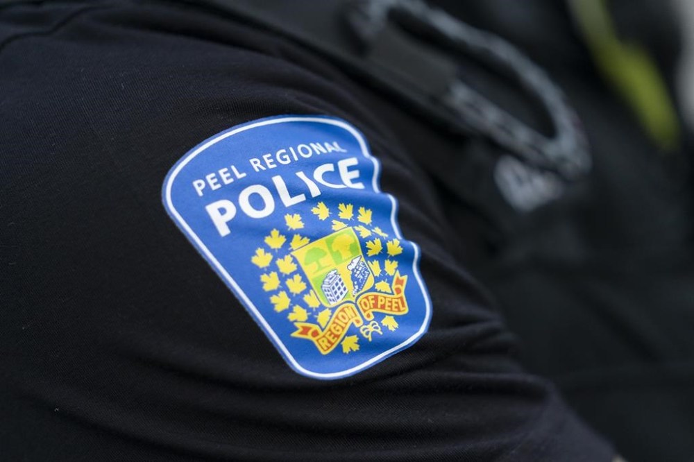 A Peel Police shoulder patch is seen in Mississauga, Ont., on Saturday, July 1, 2023. Police say a 31-year-old man has been charged in the alleged sexual assault of a three-year-old boy at a Brampton, Ont., hospital. THE CANADIAN PRESS/Arlyn McAdorey