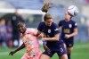 FILE - Orlando Pride forward Barbra Banda, left, goes up for the ball against Seattle Reign defender Lauren Barnes (3) during the first half of an NWSL soccer match, Sunday, May 19, 2024, in Seattle. (AP Photo/Lindsey Wasson, File)