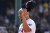 Boston Red Sox first baseman Dominic Smith tips his cap after pitching during the ninth inning of a baseball game against the Houston Astros, Sunday, Aug. 11, 2024, in Boston. (AP Photo/Michael Dwyer)