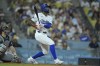 Los Angeles Dodgers Jason Heyward (23) hits a pinch hit three-run home run in the eighth inning of a baseball game against the Seattle Mariners, Tuesday, Aug. 20, 2024, in Los Angeles. (AP Photo/Jayne-Kamin-Oncea)