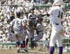 Kyoto International High School's team members celebrate as they won Japan's famous summer high school baseball tournament at a stadium in Nishinomiya, western Japan Friday, Aug. 23, 2024. (Kyodo News via AP)