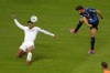 Atalanta's Berat Djimsiti, right, attempts a shot at goal in front of Real Madrid's Jude Bellingham during the UEFA Super Cup Final soccer match between Real Madrid and Atalanta at the Narodowy stadium in Warsaw, Poland, Wednesday, Aug. 14, 2024. (AP Photo/Darko Vojinovic)