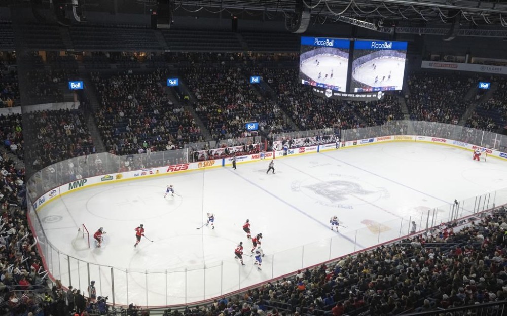 The American Hockey League has mandated the use of cut-resistant neck protection by all of its players and on-ice officials. The Laval Rocket play the Utica Comets during an AHL hockey game in Laval, Que., Wednesday, Nov. 1, 2023. THE CANADIAN PRESS/Christinne Muschi