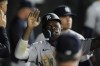 New York Yankees' Jazz Chisholm Jr. celebrates after scoring on a single by Anthony Volpe during the fifth inning of a baseball game against the Chicago White Sox, Monday, Aug. 12, 2024, in Chicago. (AP Photo/Erin Hooley)