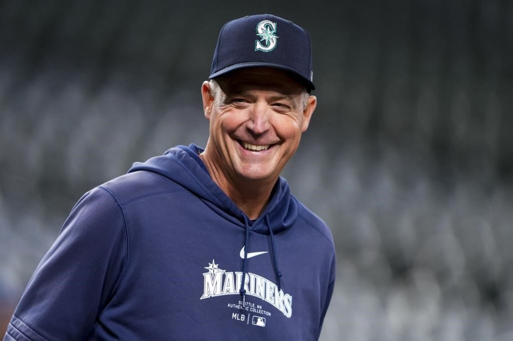 Seattle Mariners manager Dan Wilson smiles during batting practice before a baseball game against the San Francisco Giants, Friday, Aug. 23, 2024, in Seattle. (AP Photo/Lindsey Wasson)