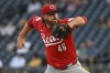 Cincinnati Reds pitcher Buck Farmer delivers against the Pittsburgh Pirates in the first inning of a baseball game, Friday, Aug. 23, 2024, in Pittsburgh. (AP Photo/Barry Reeger)
