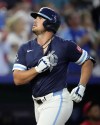 Kansas City Royals' Hunter Renfroe, right, celebrates after hitting a two-run home run during the third inning of a baseball game against the Philadelphia Phillies Friday, Aug. 23, 2024, in Kansas City, Mo. (AP Photo/Charlie Riedel)