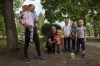 Iryna Belikova, 37, with her six children and husband, Ihor, wait for evacuation in Pokrovsk, Donetsk region, Ukraine, Friday, Aug. 23, 2024. (AP Photo/Evgeniy Maloletka)