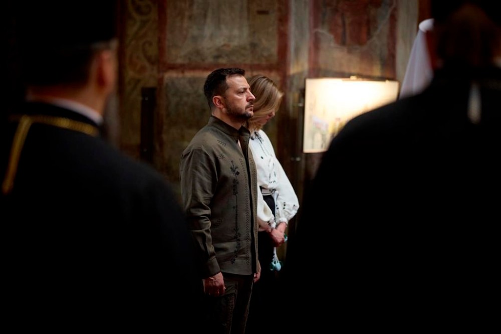 In this photo provided by the Ukrainian Presidential Press Office, Ukrainian President Volodymyr Zelenskyy and his wife Olena attend a service in Saint Sophia Cathedral during celebration of the Ukrainian Independence Day in Kyiv, Ukraine, Saturday, Aug. 24, 2024. (Ukrainian Presidential Press Office via AP)