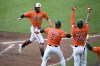 Baltimore Orioles' Colton Cowser (17) celebrates with Gunnar Henderson (2) and designated hitter Eloy Jimenez (72) after they scored on a double by Jackson Holliday during the sixth inning of a baseball game against the Houston Astros, Saturday, Aug. 24, 2024, in Baltimore. (AP Photo/Nick Wass)