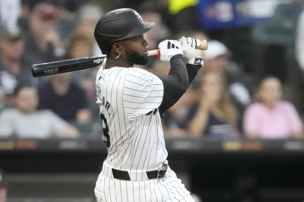 Chicago White Sox's Luis Robert Jr. watches his RBI single off Detroit Tigers starting pitcher Tarik Skubal, scoring Brooks Baldwin, during the third inning of a baseball game Saturday, Aug. 24, 2024, in Chicago. (AP Photo/Charles Rex Arbogast)