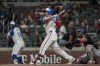 Atlanta Braves outfielder Ramón Laureano (18) hits a solo homer in the eighth inning of a baseball game against the Washington Nationals, Saturday, Aug. 24, 2024, in Atlanta. (AP Photo/Mike Stewart)