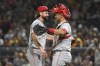 Cincinnati Reds relief pitcher Casey Kelly celebrates with catcher Luke Maile after defeating the Pittsburgh Pirates 10-2 during a baseball game, Saturday, Aug. 24, 2024, in Pittsburgh. (AP Photo/Barry Reeger)