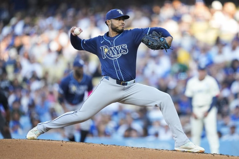 Tampa Bay Rays center fielder Jonny DeLuca throws during the first inning of a baseball game against the Los Angeles Dodgers in Los Angeles, Saturday, Aug. 24, 2024. (AP Photo/Ashley Landis)