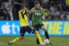 Nashville SC midfielder Patrick Yazbek, left, kicks the ball past Austin FC defender Guilherme Biro, right, during the first half of an MLS soccer match Saturday, Aug. 24, 2024, in Nashville, Tenn. (AP Photo/George Walker IV)
