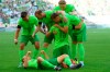Wolfsburg's Lovro Majer, center kneeling, celebrates with teammates after scoring his side's second goal of the game during the German Bundesliga soccer match between VfL Wolfsburg and FC Bayern Munich at the Volkswagen Arena in Wolfsburg, Germany, Sunday, Aug. 27, 2024. (Swen Pfoertner/dpa via AP)