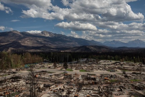 A devastated neighbourhood in west Jasper, Alberta on Monday August 19, 2024. Parks Canada says a weekend drenching of rain on parts of Jasper National Park is doing a lot to quell fire activity, but the wet weather also comes with a warning. THE CANADIAN PRESS/Amber Bracken