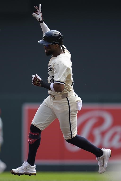 Minnesota Twins' Willi Castro runs the bases after hitting a solo home run during the first inning of a baseball game against the St. Louis Cardinals, Sunday, Aug. 25, 2024, in Minneapolis. (AP Photo/Abbie Parr)