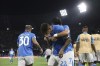 Napoli's Giovanni Di Lorenzo, center, celebrates after scoring a goal during the Serie A soccer match between Napoli and Bologna at the Diego Armando Maradona Stadium in Naples, Italy, Sunday, Aug. 25 , 2024. (Alessandro Garofalo/LaPresse via AP)
