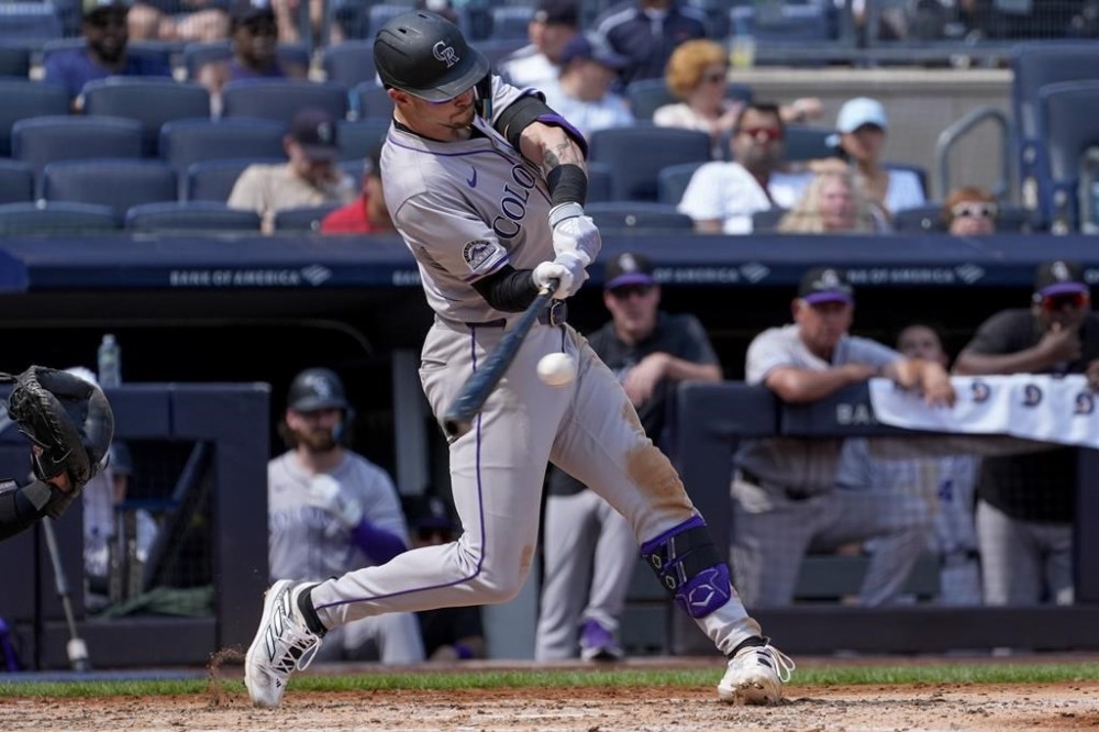 Colorado Rockies' Brenton Doyle hits a double during the third inning of a baseball game against the New York Yankees, Sunday, Aug. 25, 2024, in New York. (AP Photo/Bryan Woolston)