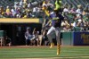 Milwaukee Brewers' Willy Adames celebrates after hitting a solo home run during the seventh inning of a baseball game against the Oakland Athletics, Sunday, Aug. 25, 2024, in Oakland, Calif. (AP Photo/Godofredo A. Vásquez)