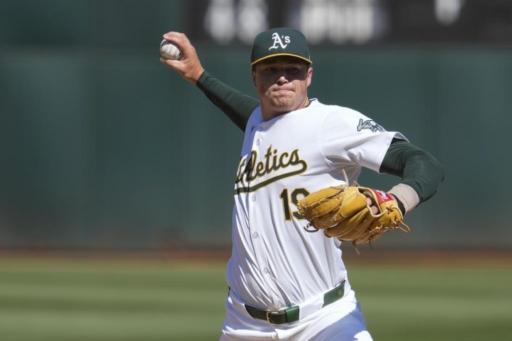 Oakland Athletics' Mason Miller pitches to a Milwaukee Brewers batter during the ninth inning of a baseball game Sunday, Aug. 25, 2024, in Oakland, Calif. (AP Photo/Godofredo A. Vásquez)