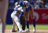 New York Mets shortstop Francisco Lindor, top, smiles with second baseman Jose Iglesias, bottom, after a force out against San Diego Padres' Jurickson Profar at second during the sixth inning of a baseball game, Sunday, Aug. 25, 2024, in San Diego. (AP Photo/Brandon Sloter)