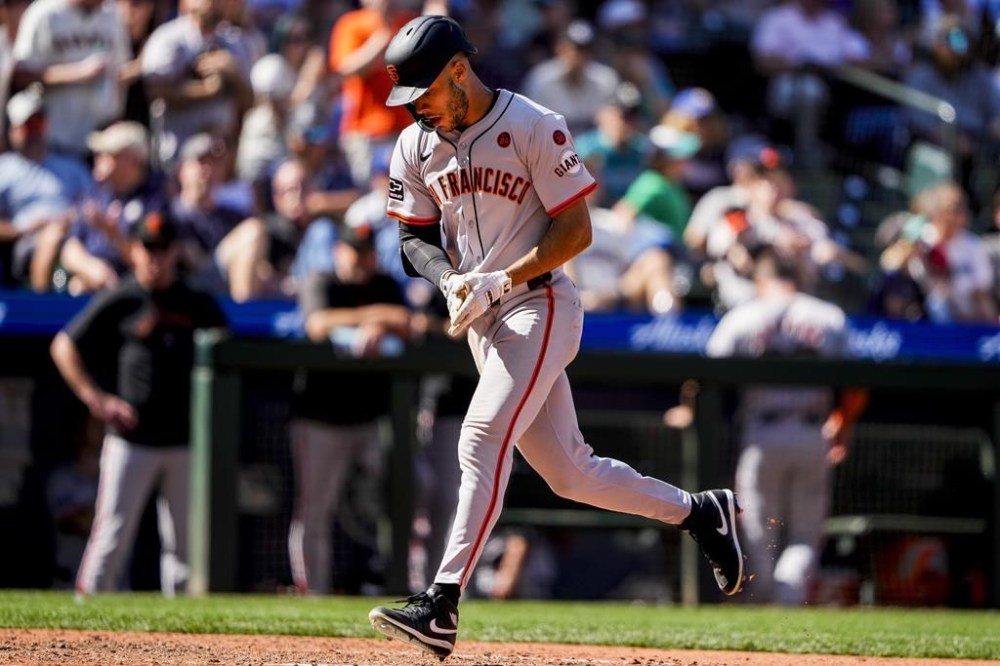 San Francisco Giants' Grant McCray jogs the bases after hitting a solo home run against the Seattle Mariners during the eighth inning of a baseball game, Sunday, Aug. 25, 2024, in Seattle. (AP Photo/Lindsey Wasson)