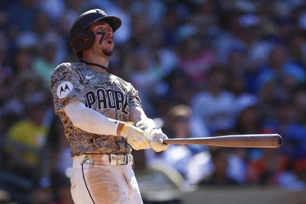 San Diego Padres' Jackson Merrill watches his walkoff solo home run during the ninth inning of a baseball game against the New York Mets, Sunday, Aug. 25, 2024, in San Diego. (AP Photo/Brandon Sloter)