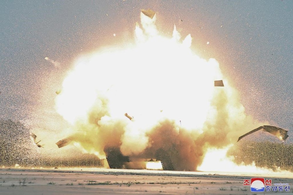 This photo provided by the North Korean government shows an explosion after it says a drone crashed into a target in a demonstration, as its leader Kim Jong Un was inspecting at an undisclosed location in North Korea, Saturday, Aug. 24, 2024. Independent journalists were not given access to cover the event depicted in this image distributed by the North Korean government. The content of this image is as provided and cannot be independently verified. Korean language watermark on image as provided by source reads: