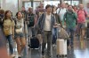 FILE - Travelers pass through Salt Lake City International Airport on July 3, 2024, in Salt Lake City. (AP Photo/Rick Bowmer, File)