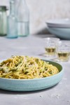 This image released by Milk Street shows a recipe for pasta with pecorino-zucchini sauce and basil. (Milk Street via AP)