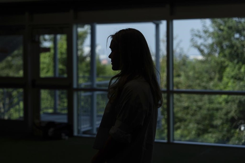 Paralympic swimmer Ali Truwit looks on as her mother, Jody Truwit, speaks during an interview with The Associated Press at Chelsea Piers Athletic Club, Friday, Aug. 2, 2024, in Stamford, Conn. (AP Photo/Julia Nikhinson)