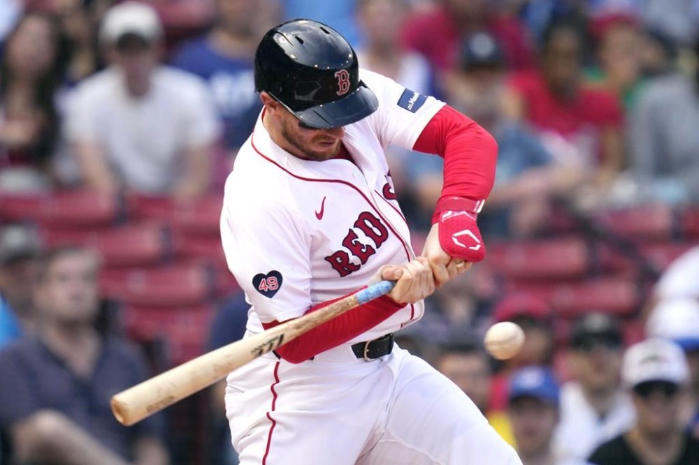 Boston Red Sox catcher Danny Jansen lines out during the resumption of the second inning of a baseball game against the Toronto Blue Jays, which was delayed due to rain in June, against the Toronto Blue Jays at Fenway Park, Monday, Aug. 26, 2024, in Boston. (AP Photo/Charles Krupa)