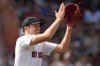 Boston Red Sox pitcher Nick Pivetta applauds after a diving catch by outfielder Wilyer Abreu on a fly ball hit by Toronto Blue Jays's Leo Jimenez during the fifth inning of a baseball game at Fenway Park, Monday, Aug. 26, 2024, in Boston. (AP Photo/Charles Krupa)