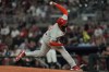 Philadelphia Phillies pitcher José Alvarado (46) delivers against the Atlanta Braves in the eighth inning of a baseball game, Tuesday, Aug. 20, 2024, in Atlanta. (AP Photo/Mike Stewart)