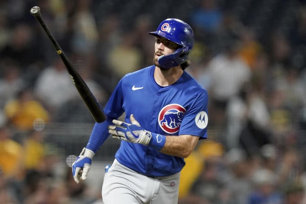 Chicago Cubs' Dansby Swanson tosses his bat after hitting a grand slam during the sixth inning of a baseball game against the Pittsburgh Pirates, Monday, Aug. 26, 2024, in Pittsburgh. (AP Photo/Matt Freed)